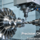 High-precision CNC turning center machining a titanium aerospace component, showcasing advanced manufacturing technology capable of holding tight tolerances.